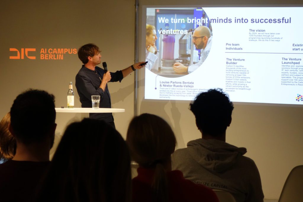 Michael Langguth presents Carbon13's venture builder programme to a room of climate tech founders