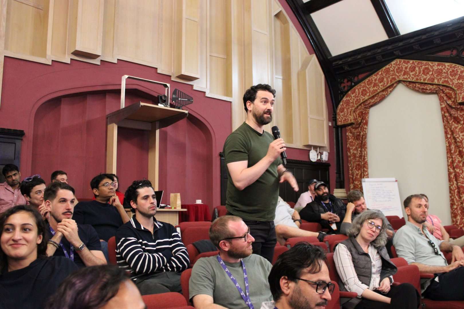 A Cohort 11 founder asks a question during a session in Cambridge